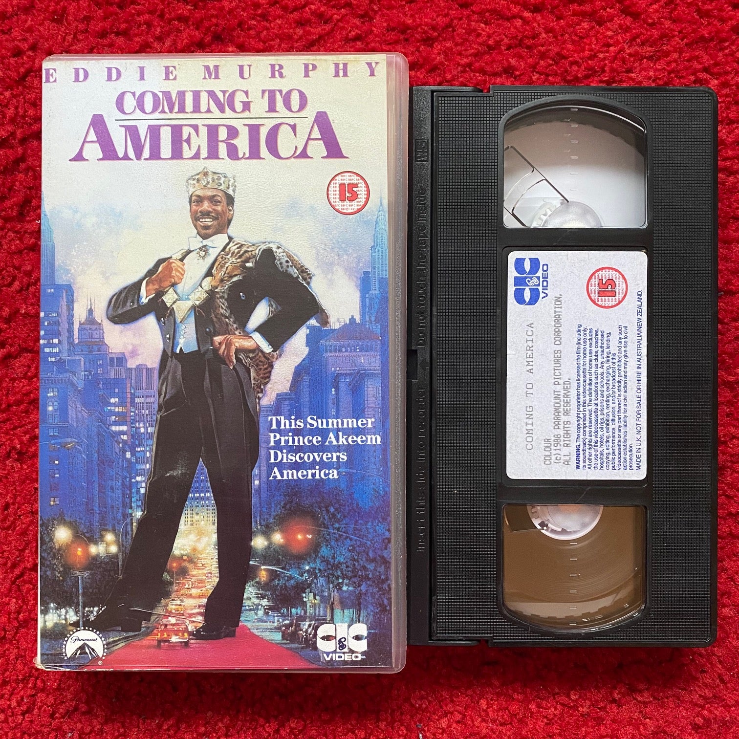 https://www.horrorstock.com/cdn/shop/products/coming_to_america_vhs_video_1988_vhr2320_1512x.jpg?v=1701731765